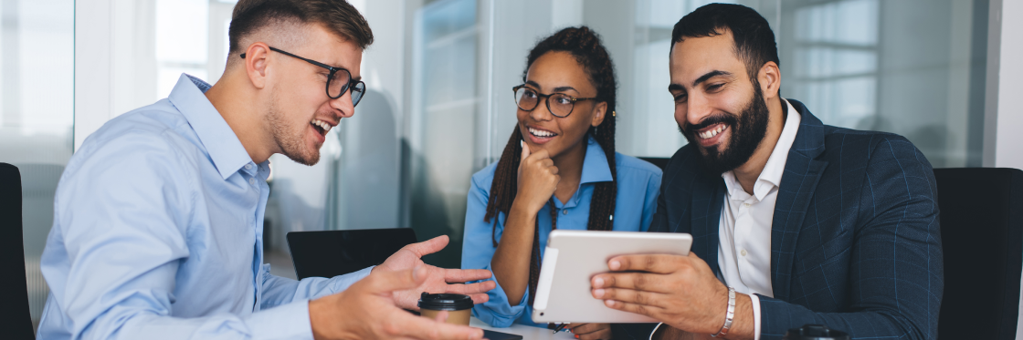 17 fun presentation ideas (with video!) to wow your audience Three professionals in a meeting, discussing over a digital tablet with positive expressions, using Biteable video maker.