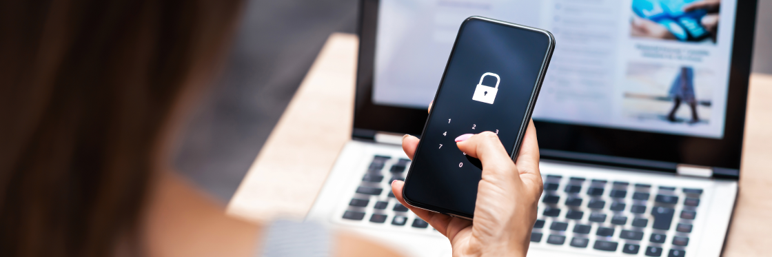How Cyber Innovative Technologies uses Biteable to excite investors Person entering a security passcode on a smartphone with a laptop in the background.