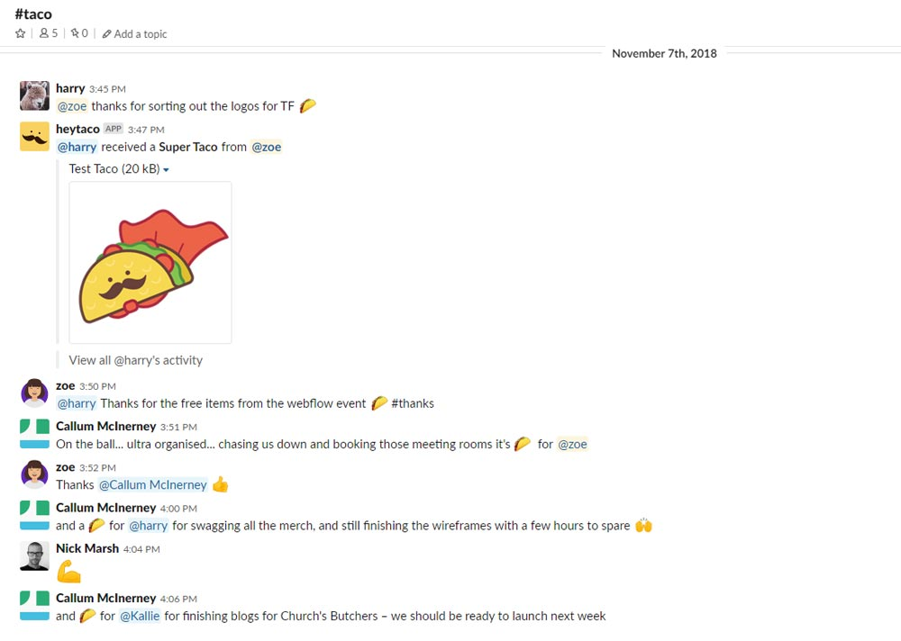 A screenshot of a slack conversation with participants discussing various work-related topics and a taco emoji being shared.