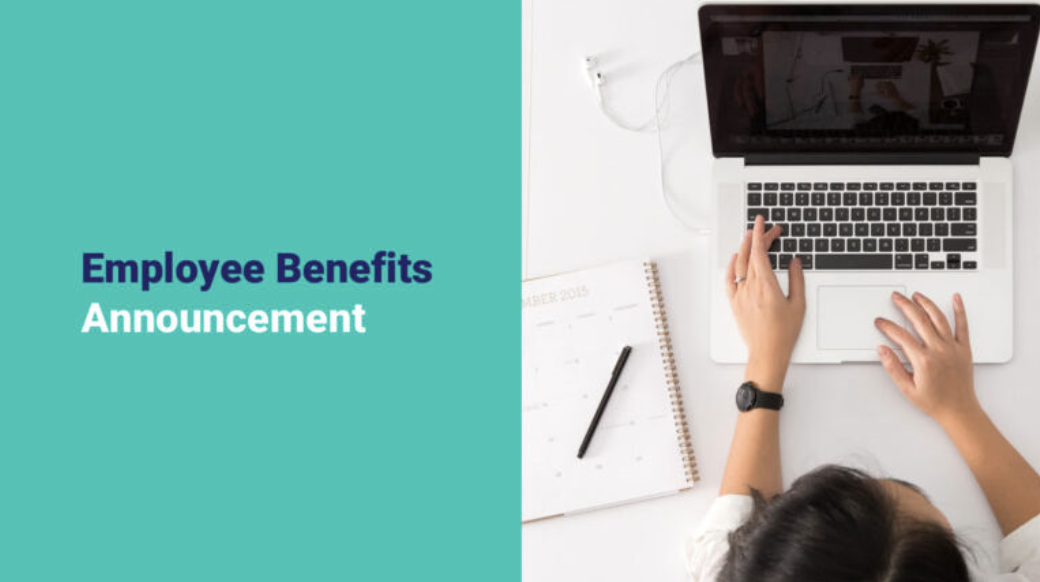 Overhead view of a person working on a laptop with text stating "employee benefits announcement".
