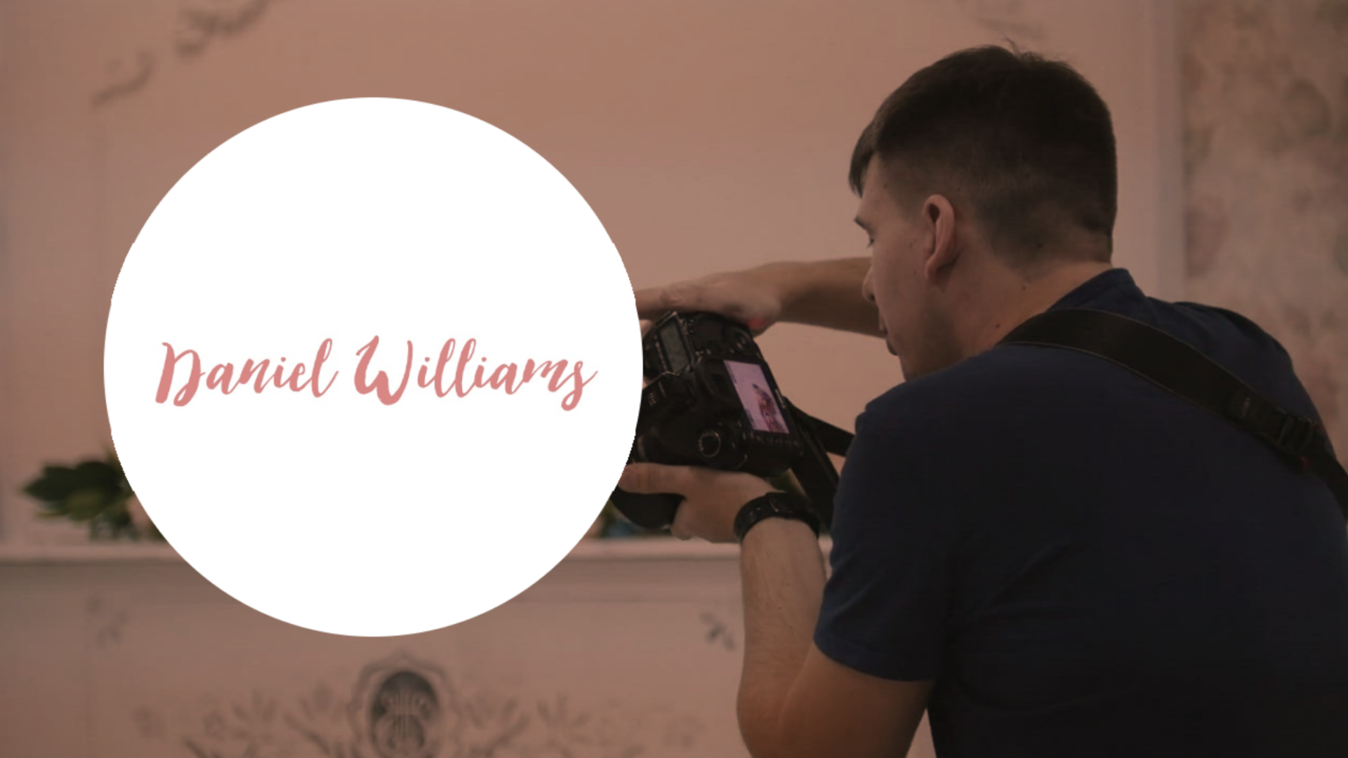 Photographer adjusting camera equipment with a Biteable video maker watermark overlay.