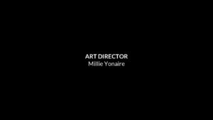 Film credits screen created with Biteable video maker displaying the position of art director, held by a person named Millie Yonaire.