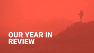 A silhouetted figure standing on a rocky terrain against a red-tinted misty background with the text "Biteable video maker: our year in review.