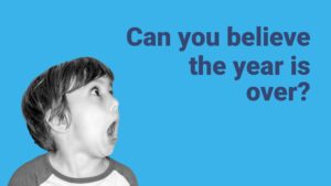 A shocked young boy with wide eyes and an open mouth on a blue background next to the text "can you believe the year is over?", created using Biteable video maker.