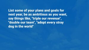 Text on a blue background with motivational goals including "triple our revenue," "double our team," and "adopt every stray dog in the world," created using Biteable video maker.