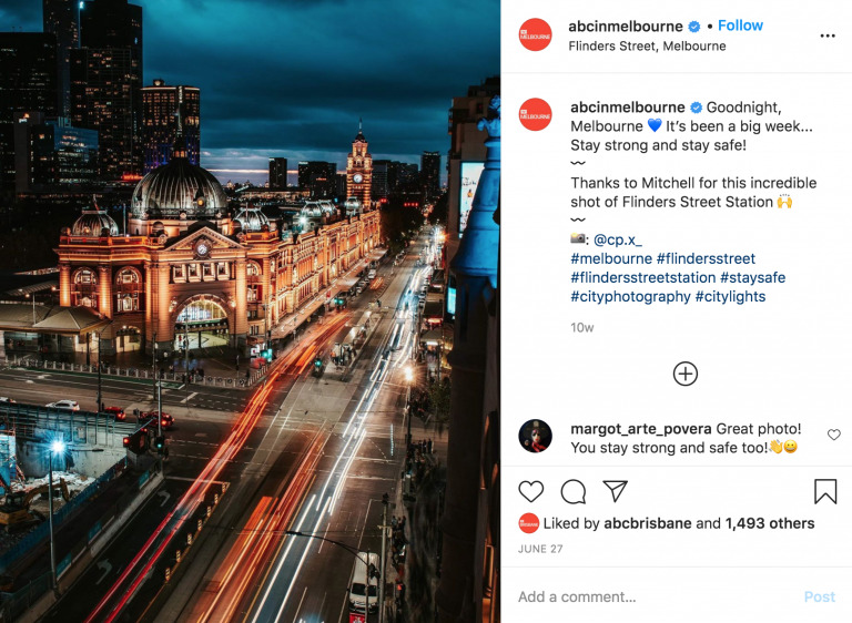 A nighttime cityscape of Flinders Street, Melbourne with illuminated streets and historic buildings, viewed from an elevated perspective, captured in a Biteable video.