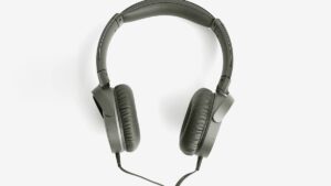 A pair of over-ear wired headphones with black cushioned ear pads, positioned against a plain white background.