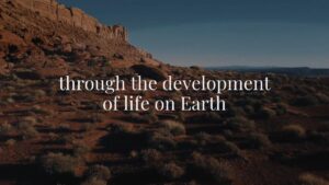 A rocky desert landscape with sparse vegetation and cliffs, overlaid with the text: "through the development of life on Earth.
