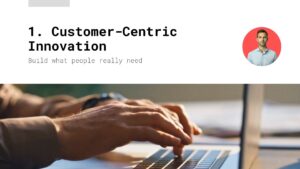 Close-up of hands typing on a laptop keyboard, with the text "Customer-Centric Innovation: Build what people really need" and a small photo of a man in the corner.